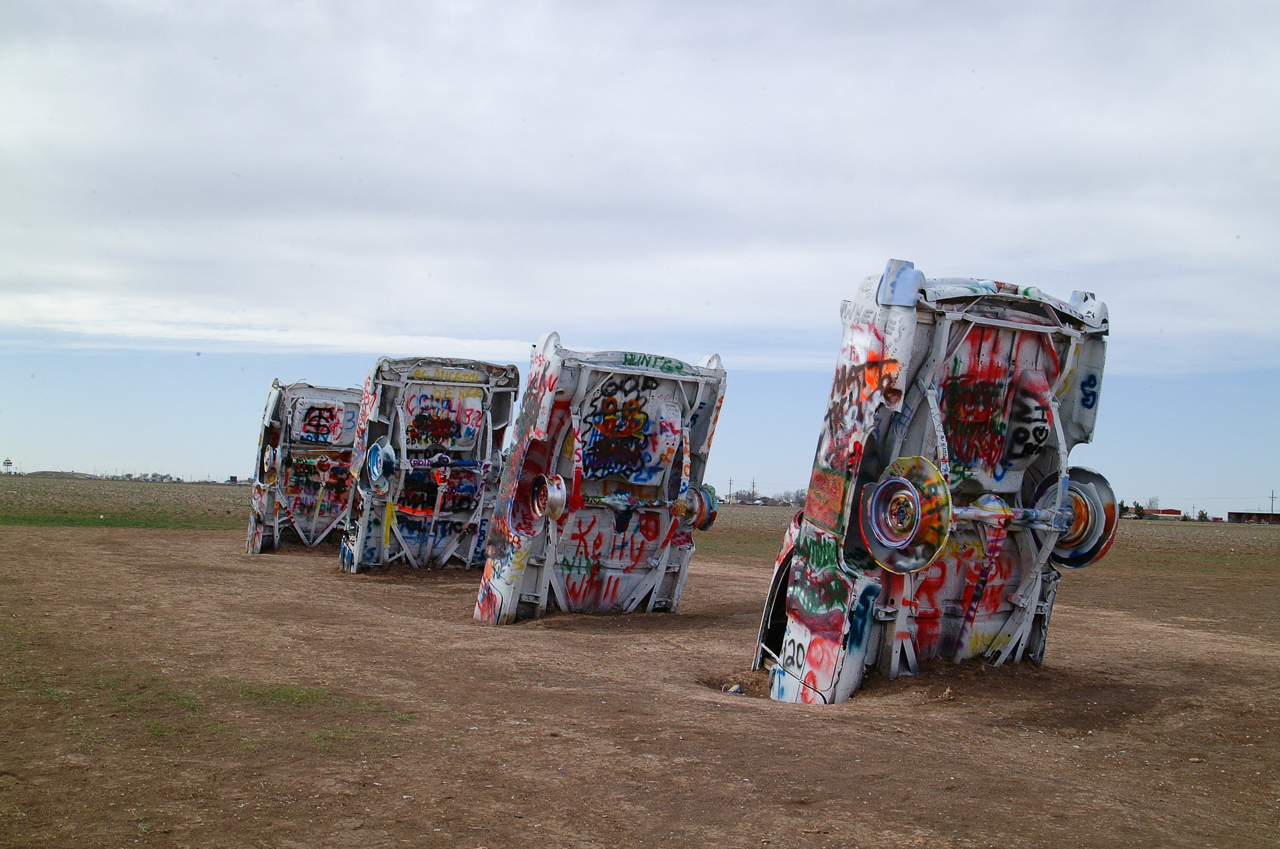 Closer to Amarillo is the famous Cadillac Ranch. About ten large, finned Cadillacs are buried nose first in a field. Visitors are encouraged to add their own artistic touches to the automobiles.