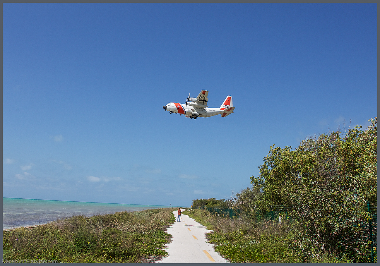 A Coast Guard prop plane takes off over Geiger Beach from the Boca Chica US Naval Air Station.