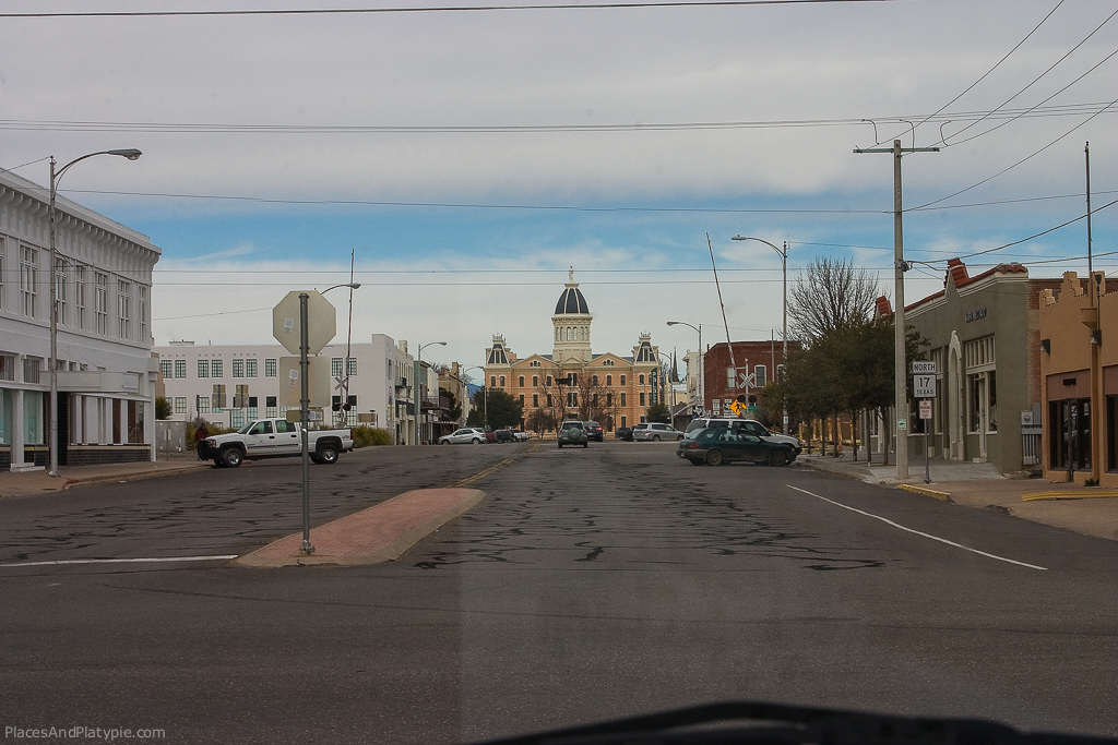 The Presidio County Courthouse rises over the small town's main street.
