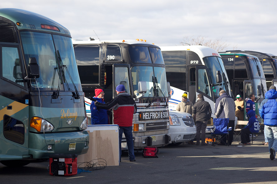 Corporate Tailgating in luxury rental buses. There were rows of them.