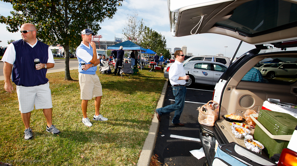 One stylin tailgating spokesmodel strikes a comfortable pose while lesser men scatter!